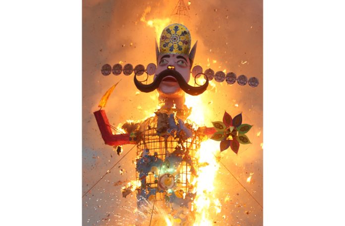The effigy of demon King Ravan in flames at Parade Ground on Thursday. — Excelsior/Rakesh