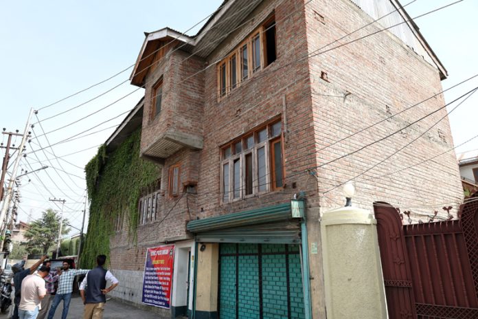 View of the head office of the banned Tehreek-e-Hurriyat at Hyderpora attached by Budgam police on Wednesday. -Excelsior/Shakeel