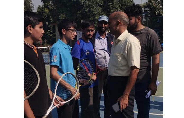 Dignitary interacting with players during a match.