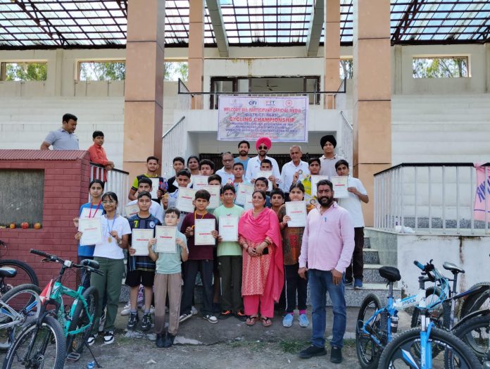 Winners posing with dignitaries during closing ceremony of District Reasi Cycling Championship 2025.