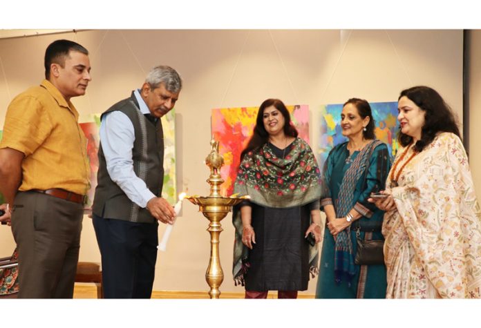 Dignitaries lighting the lamp at solo art exhibition 'Measuring the Intangible' by Roma Bahl at Lalit Kala Akademi, New Delhi.