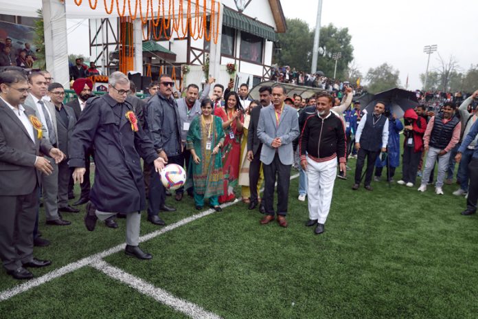 Chief Minister Omar Abdullah displaying his football skills during the inauguration of the 69th National School Games in Srinagar on Monday.-Excelsior/Shakeel