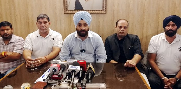 AJKTWA Chairman Karan Singh Wazir talking to media-persons in Jammu on Tuesday. -Excelsior/ Rakesh