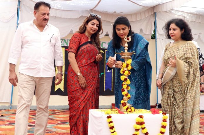Dignitaries light the traditional lamp at leadership programme on Wednesday.