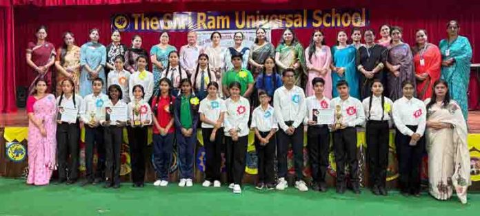 Students posing along with dignitaries during a programme. Students posing along with dignitaries during a programme.