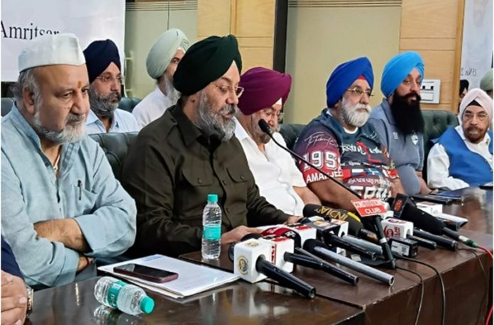 Ravinder Pandita, President of All India Kashmiri Samaj along with others addressing press conference in New Delhi.