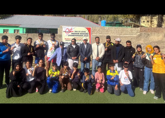 Young athletes posing along with dignitaries during an event.