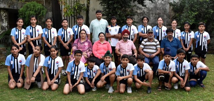 Girls and Boys J&K Roll Ball teams posing along with support staff and officials.