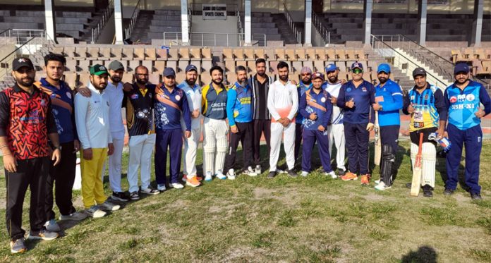 Cricket teams posing for a group photograph.