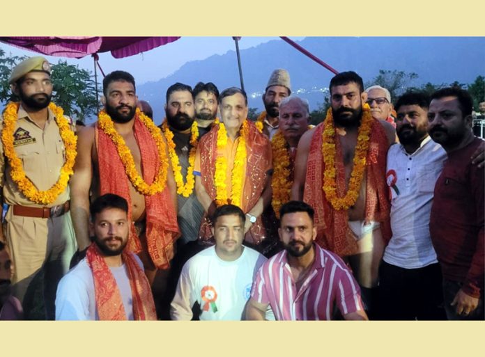 Winners of various bouts posing with guests at Kalka Akhara, Nai Basti, Reasi.
