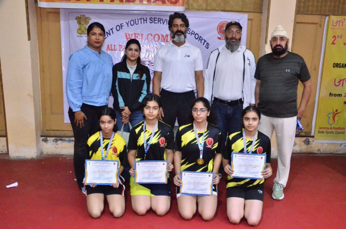 Winning team poses with certificates and dignitaries at MA Stadium, Jammu.