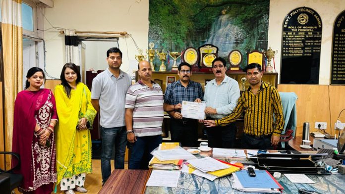Certificate being presented to Resource Person by college management for his expert session.