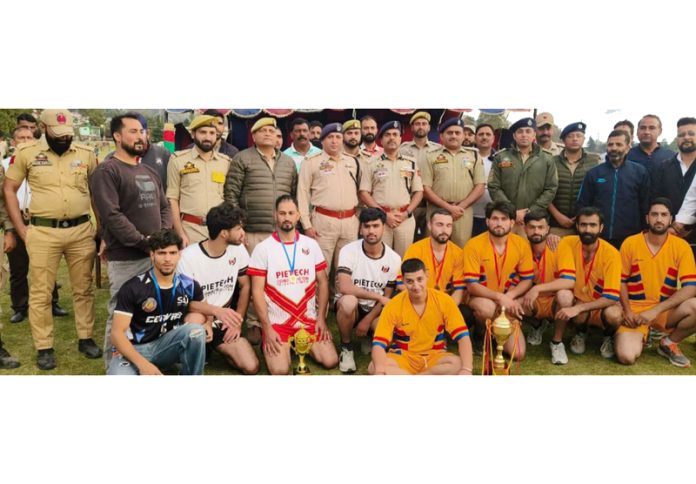 Volleyball players posing for group photograph.