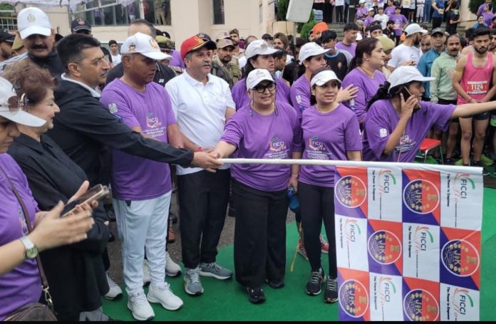 IGP Jammu Bhim Sen Tuti inaugurating Jammu Half Marathon alongside other dignitaries at Gulshan Ground on Sunday.