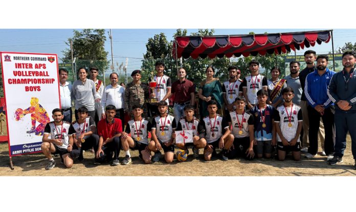 APS boys Volleyball team posing with Principal, guests and their coaches after winning the Championship.