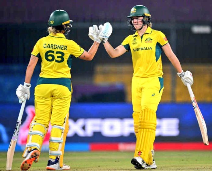 Annabel Sutherland and Ashleigh Gardner celebrating after defeating England.