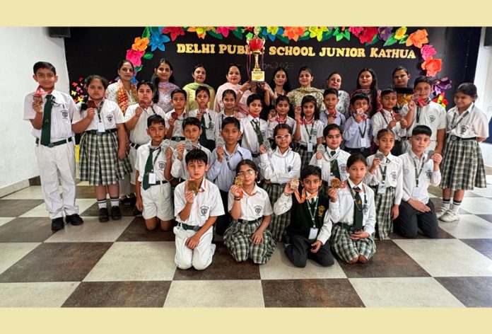 DPS Junior Kathua team which emerged overall champion in North India Open Karate-Do Championship posing with teachers.