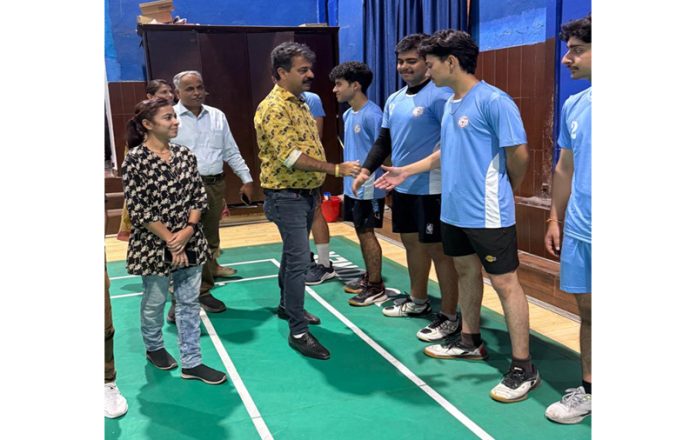 Dignitary interacting with players.