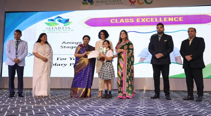 Dignitaries presenting trophy and certificate to a student during a programme.