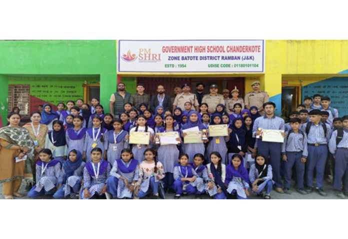 Students along with others posing for a group photograph during an event to celebrate 150th birth anniversary of Sardar Vallabhbhai Patel in Ramban on Wednesday.