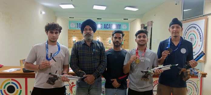 Shooters posing along with medals at Jammu University. Shooters posing along with medals at Jammu University.
