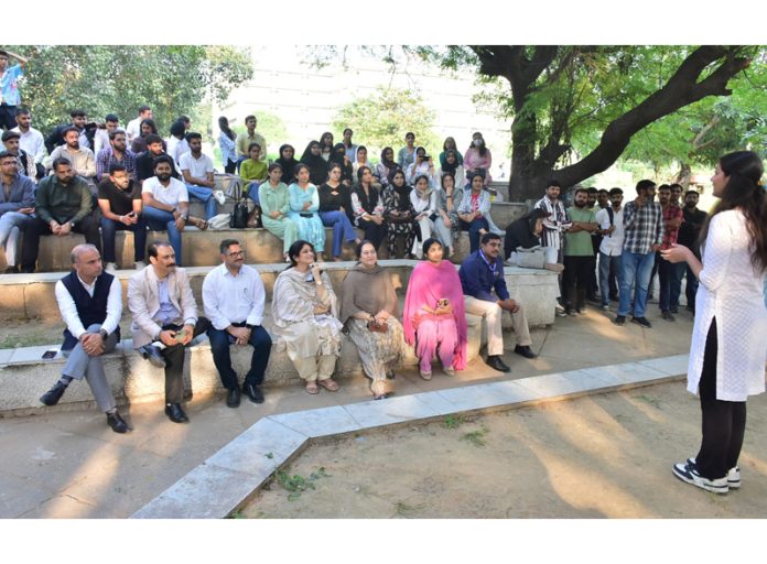 Students and others watching a Nukkad Natak at University of Jammu during an event organised by POWERGRID on Wednesday.