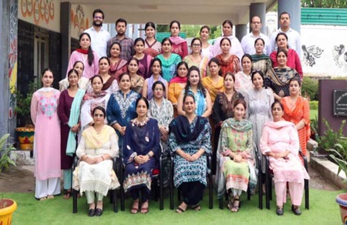 Participants posing along with resource persons during a workshop.