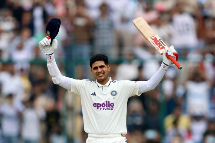 Shubman Gill raises his bat in triumph after scoring an unbeaten century in the second Test against West Indies at Arun Jaitley Stadium in Delhi on Saturday. (UNI )