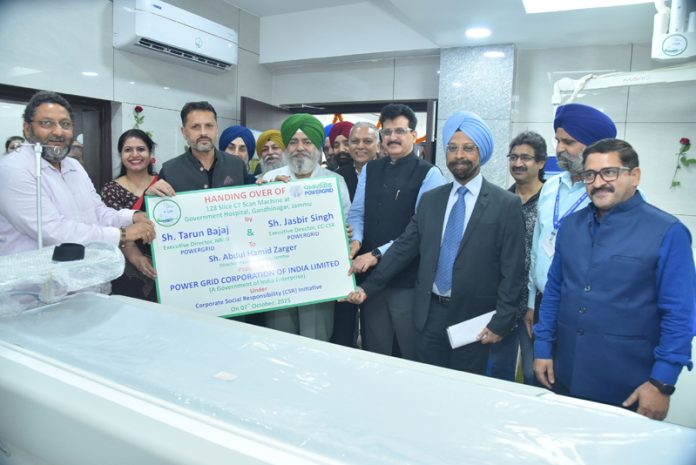Officials of Powergrid handing over a CT Scan machine to DHS in Jammu. Officials of Powergrid handing over a CT Scan machine to DHS in Jammu.