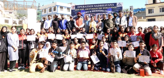 DC Harvinder Singh and Para Archer Sheetal Devi posing along with budding athletes at Doda. - Excelsior/Tilak Raj DC Harvinder Singh and Para Archer Sheetal Devi posing along with budding athletes at Doda. - Excelsior/Tilak Raj