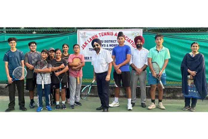 B S Jaggi, Honorary General Secretary, J&K Lawn Tennis Association posing with players at the inaugural event.