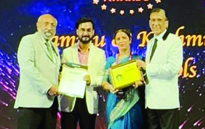 Jammu Sanskriti School Kathua representative receiving award in Delhi.