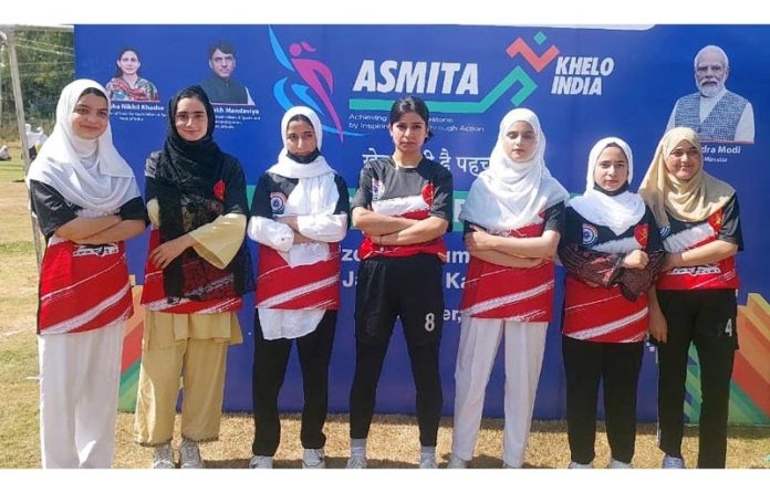 Rugby players posing during an event.