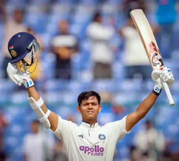 Yashasvi Jaiswal raising his bat after scoring century agains West Indies at New Delhi.