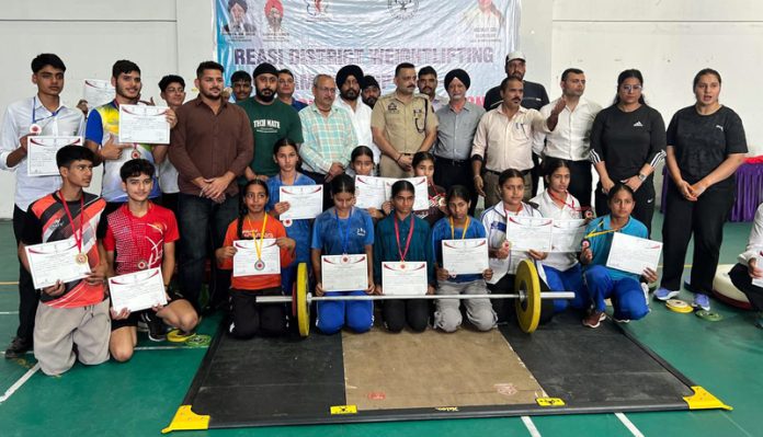 Weightlifters posing along with dignitaries during prize distribution ceremony. Weightlifters posing along with dignitaries during prize distribution ceremony.