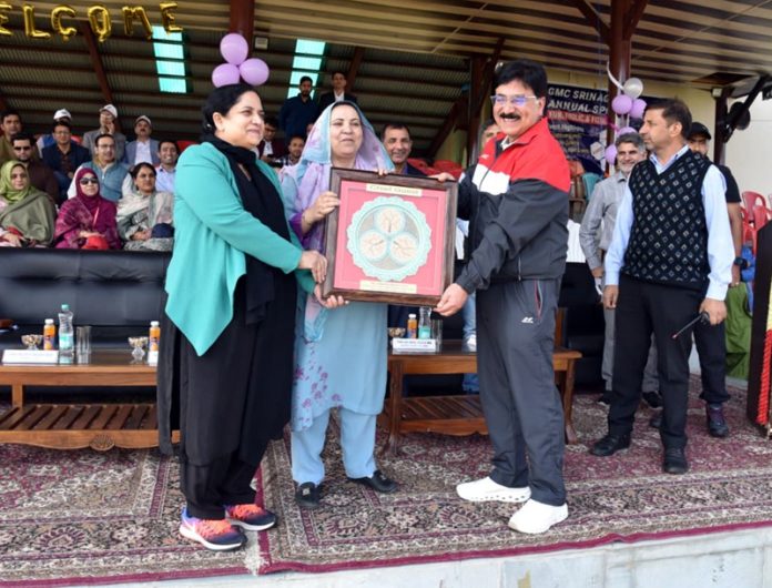 Health Minister Sakeena Itoo receiving memento from GMC Srinagar administration.