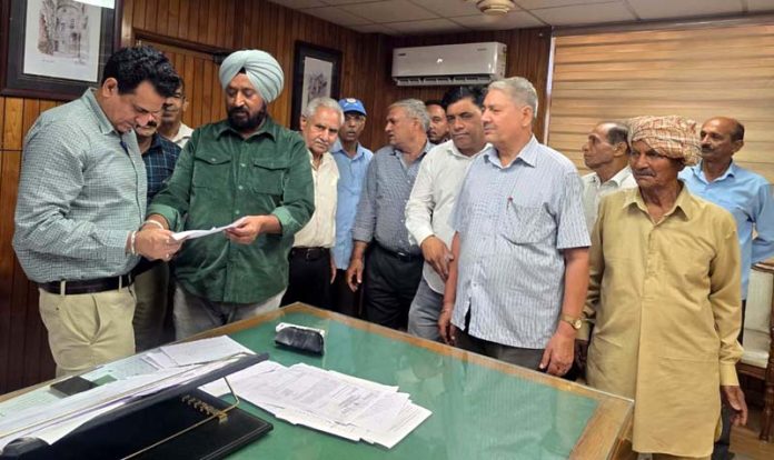 DDC Suchetgarh T S Tony presenting a memorandum to PWD SE Ashwani Sharma.