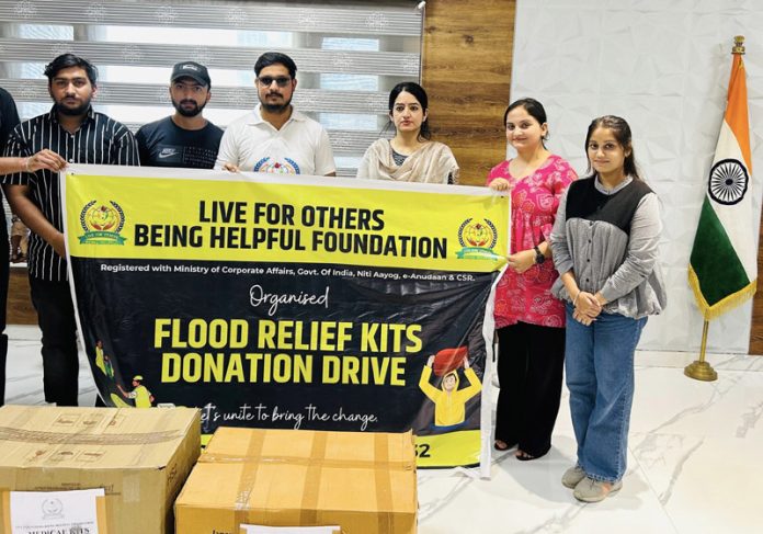 Members of LFO-BHF handing over relief material to DC Udhampur Saloni Rai.