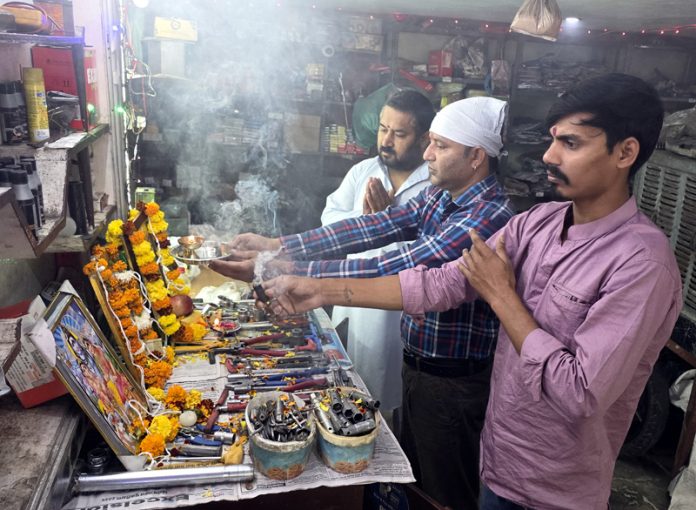 Workers worshipping mechanical tools on the occasion of Vishwakarma Day in Jammu. -Excelsior/Rakesh