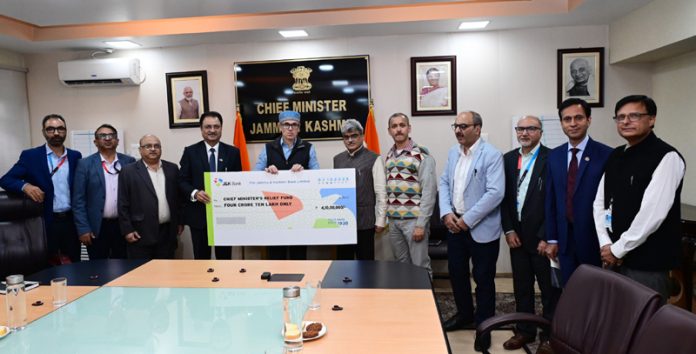 J&K Bank MD & CEO handing over cheque of Rs 4.10 crore to CM on Friday. J&K Bank MD & CEO handing over cheque of Rs 4.10 crore to CM on Friday.