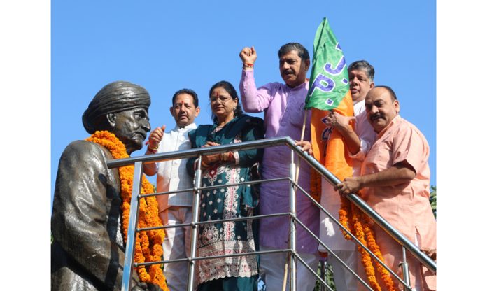 BJP leaders garlanding statue of Pt Prem Nath Dogra at Jammu. -Excelsior/Rakesh