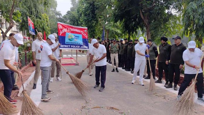 IGP Jammu BS Tuti, along with other officers cleaning a road within DPL Jammu on Thursday.