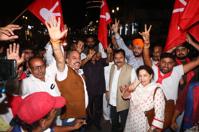 Jubiliant NC workers and leaders dancing on the victory of their three candidates in Rajya Sabha elections on Friday at Jammu. -Excelsior/Rakesh