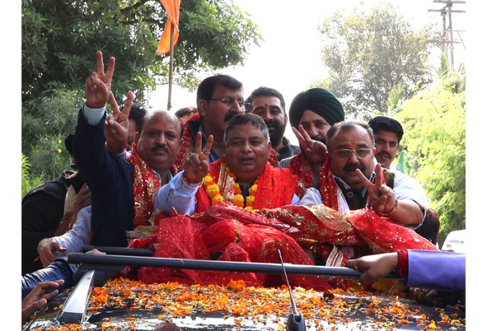 Sat Sharma, accompanied by senior BJP leaders & MLAs, being taken to party office in a rally from Jammu Airport.