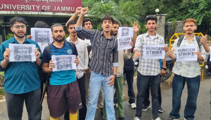 Students protesting against delay in disbursement of ST Scholarship. — Excelsior/Rakesh Students protesting against delay in disbursement of ST Scholarship. — Excelsior/Rakesh