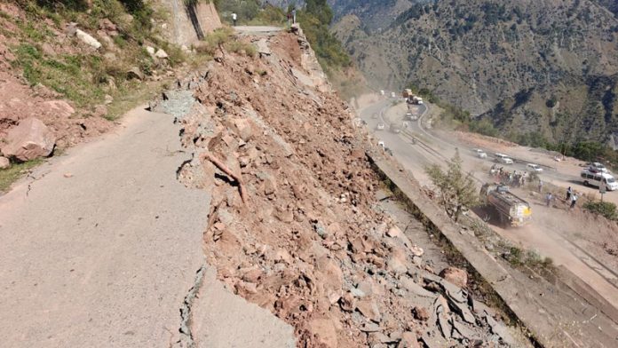 A view of damaged protection wall on NH.
