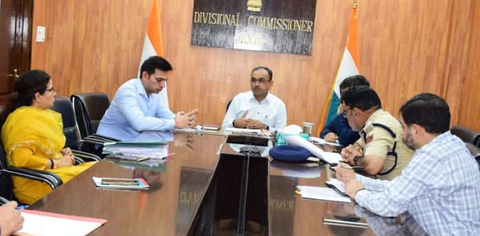 page3-5 Div Com Jammu chairing a meeting on Wednesday.