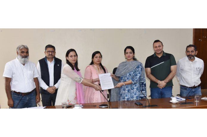 DC Udhampur handing over registration certificate to first Real Estate promoter on Monday.