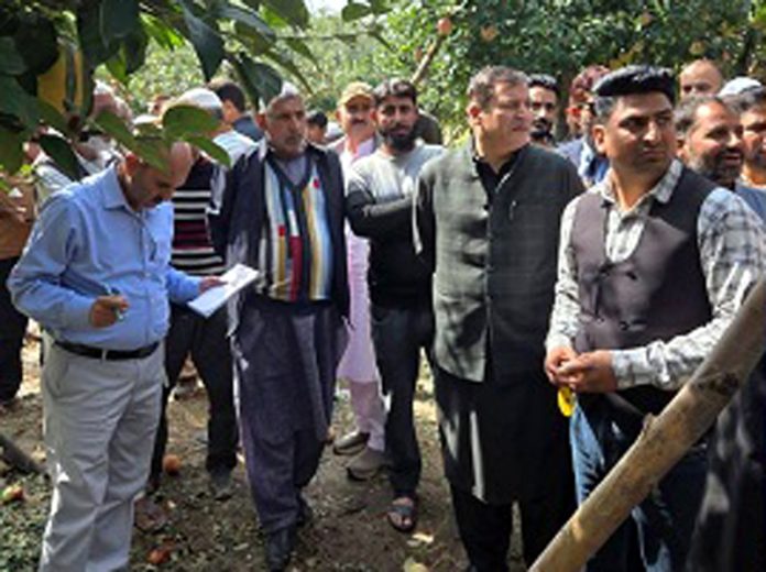 Minister Javid Dar visiting hailstorm affected village on Sunday.