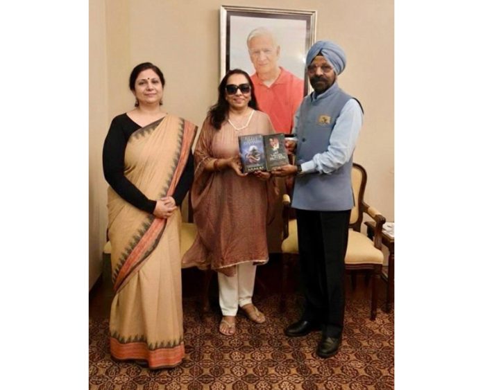 Dr Ritu Singh and S S Sodhi releasing books authored by Ruchi Chabra in Jammu.